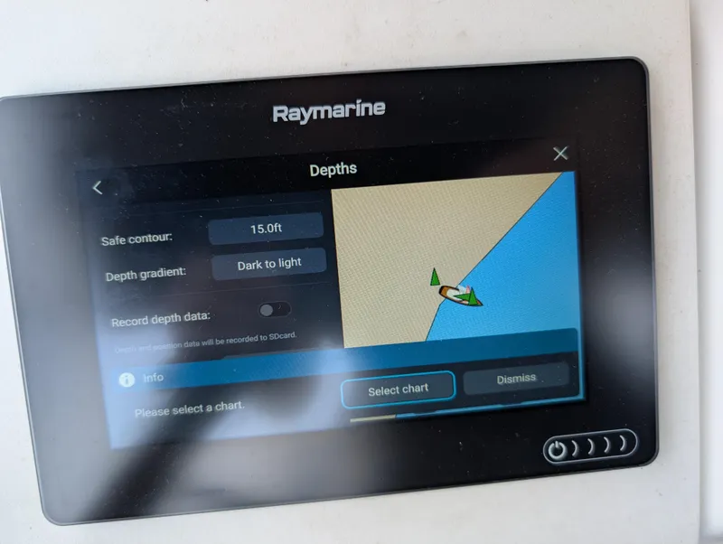 Slide: The Image of Raymarine depth display on 2003 Beneteau Oceanis 473 sailboat, showing navigation settings. - 45