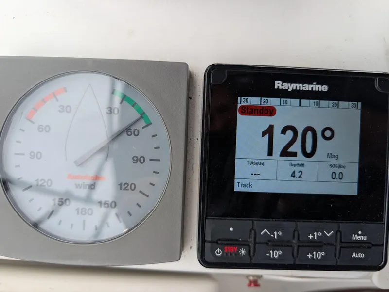 Slide: The Image of Beneteau Oceanis 473 2003 yacht instruments showing wind speed and Raymarine navigation display. - 47