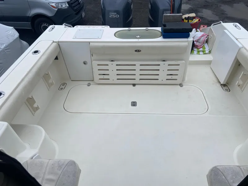 Slide: The Image of 2007 Pursuit 335 Offshore boat deck with storage and seating area. - 11