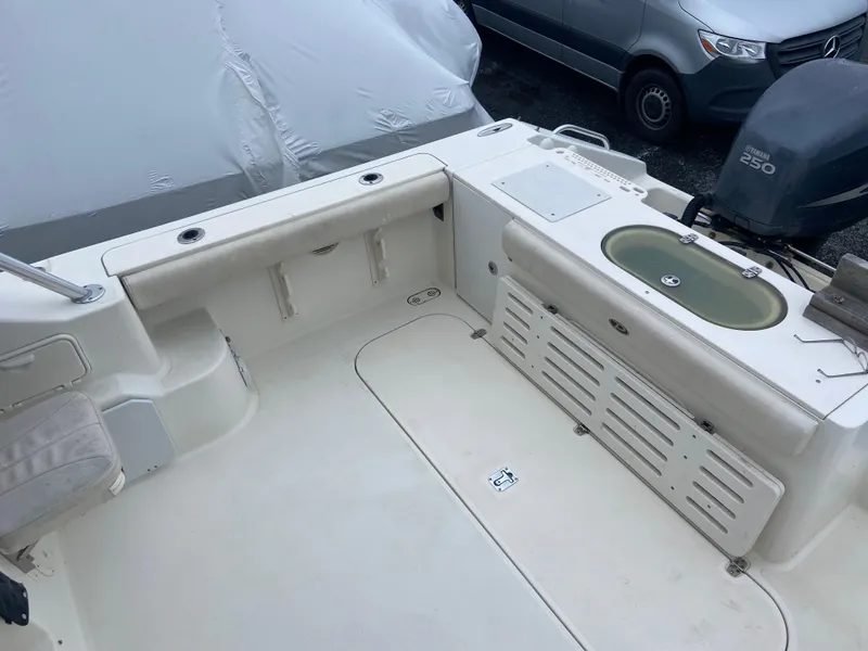 Slide: The Image of 2007 Pursuit 335 Offshore boat deck with seating and storage compartments. - 12