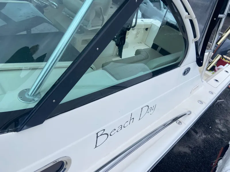 Slide: The Image of 2007 Pursuit 335 Offshore boat named "Beach Day" with sleek design and comfortable seating. - 16