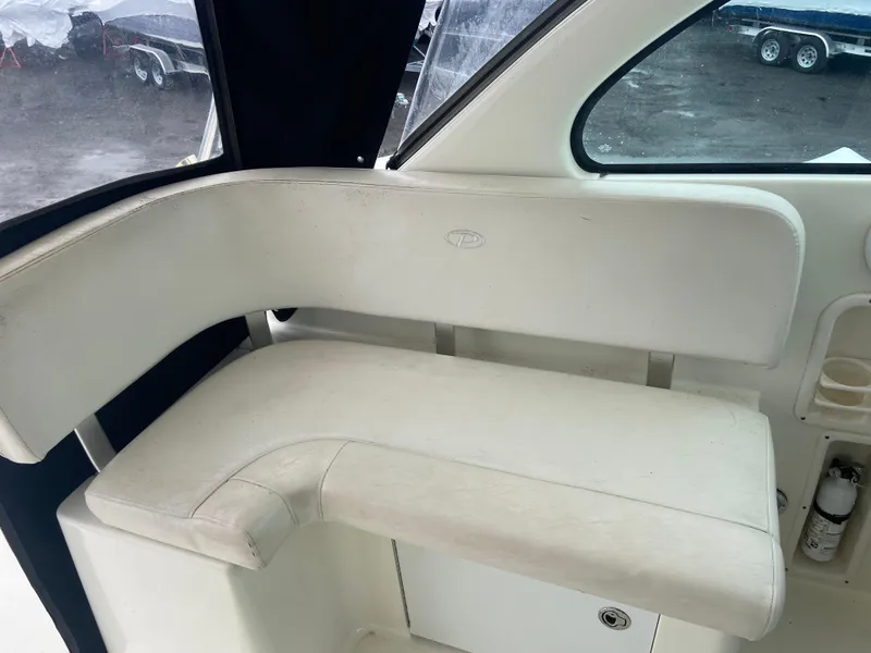 Slide: The Image of 2007 Pursuit 335 Offshore boat interior seating area. - 26
