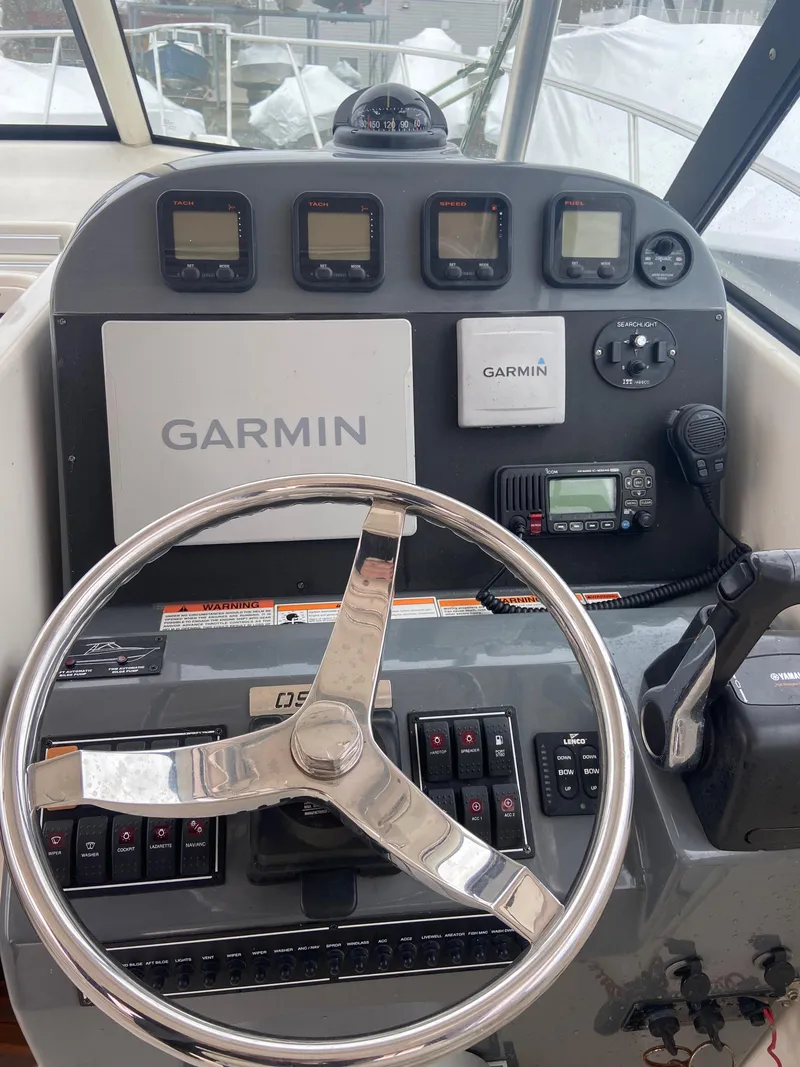 Slide: The Image of 2007 Pursuit 335 Offshore helm with Garmin navigation system and controls. - 29