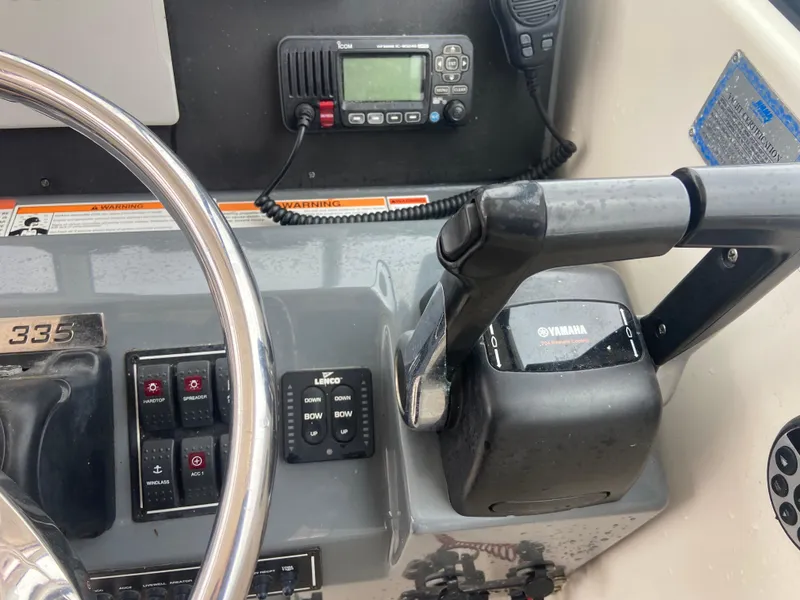 Slide: The Image of Control panel of 2007 Pursuit 335 Offshore boat with Yamaha throttle and radio equipment. - 30
