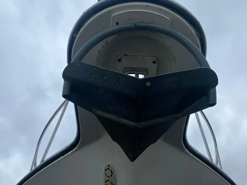 Slide: The Image of Bow view of 2007 Pursuit 335 Offshore boat with anchor against cloudy sky. - 5