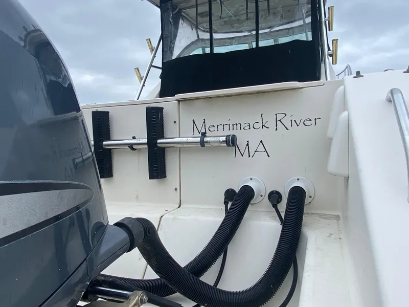 Slide: The Image of 2007 Pursuit 335 Offshore boat, Merrimack River, MA, rear view with engine and cables. - 8