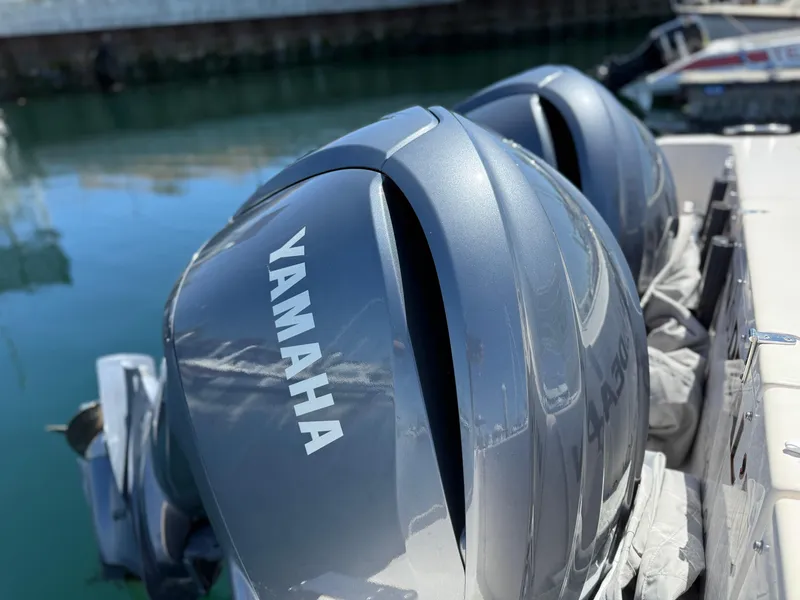 Slide: The Image of Twin Yamaha outboard engines on a 2005 Grady-White Bimini 306 boat. - 18