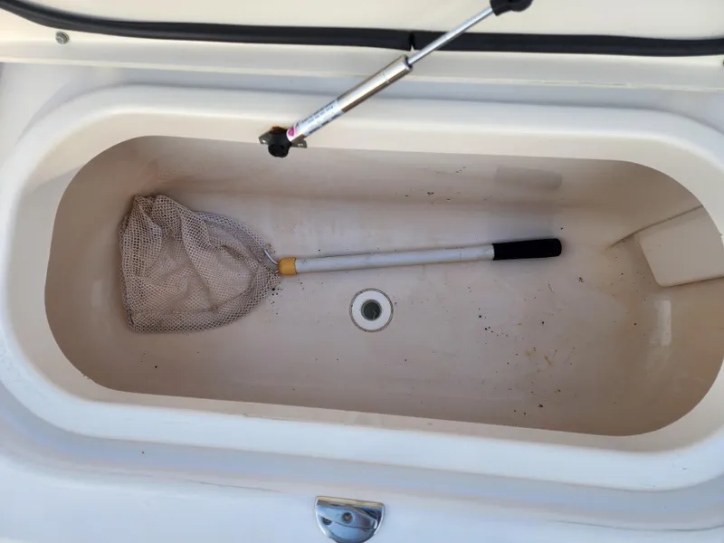 Slide: The Image of Livewell with net inside a 2005 Grady-White Bimini 306 boat. - 23