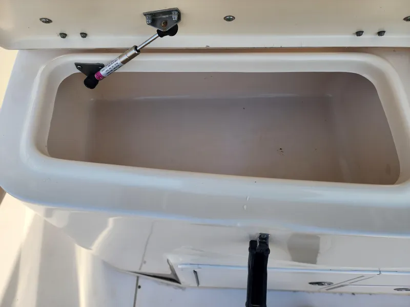 Slide: The Image of Open storage compartment on a 2005 Grady-White Bimini 306 boat. - 26