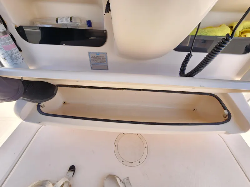 Slide: The Image of Open storage compartment on 2005 Grady-White Bimini 306 boat deck. - 28