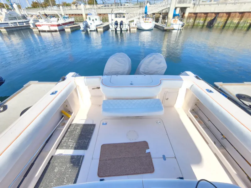 Slide: The Image of 2005 Grady-White Bimini 306 boat docked at marina, spacious deck view. - 30