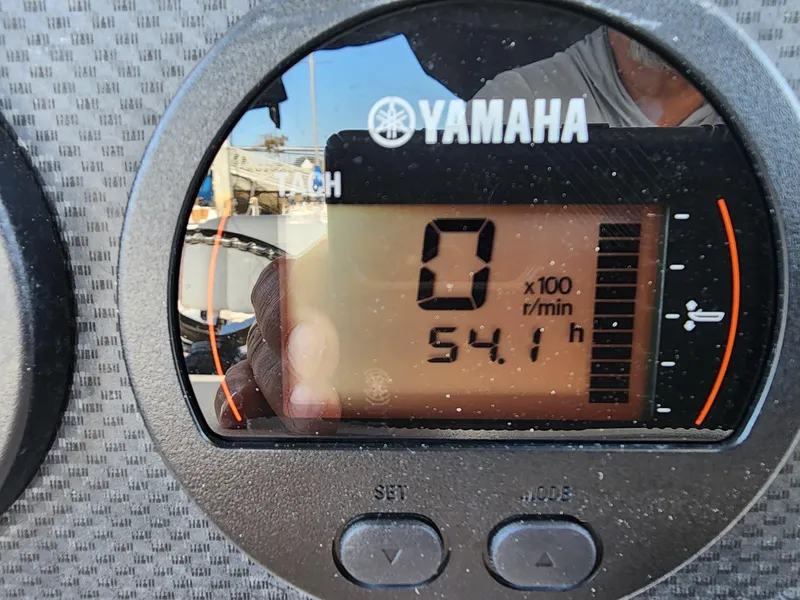 Slide: The Image of Yamaha tachometer displaying 0 RPM and 54.1 hours on a 2005 Grady-White Bimini 306 boat. - 35