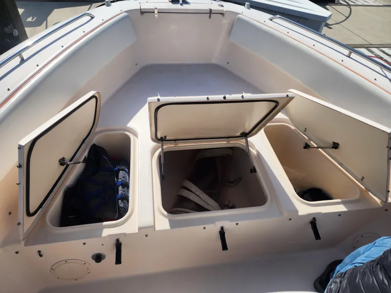 Slide: The Image of 2005 Grady-White Bimini 306 boat storage compartments with open hatches. - 36