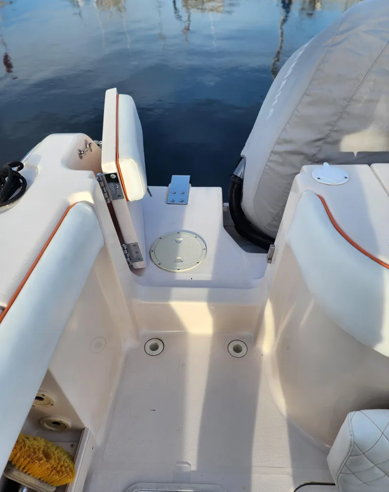 Slide: The Image of 2005 Grady-White Bimini 306 boat interior, featuring seating and deck details. - 38