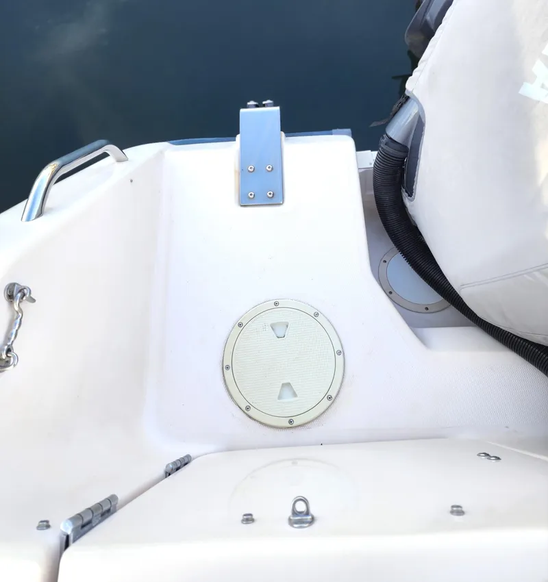 Slide: The Image of 2005 Grady-White Bimini 306 boat deck with seating and hatch detail. - 44