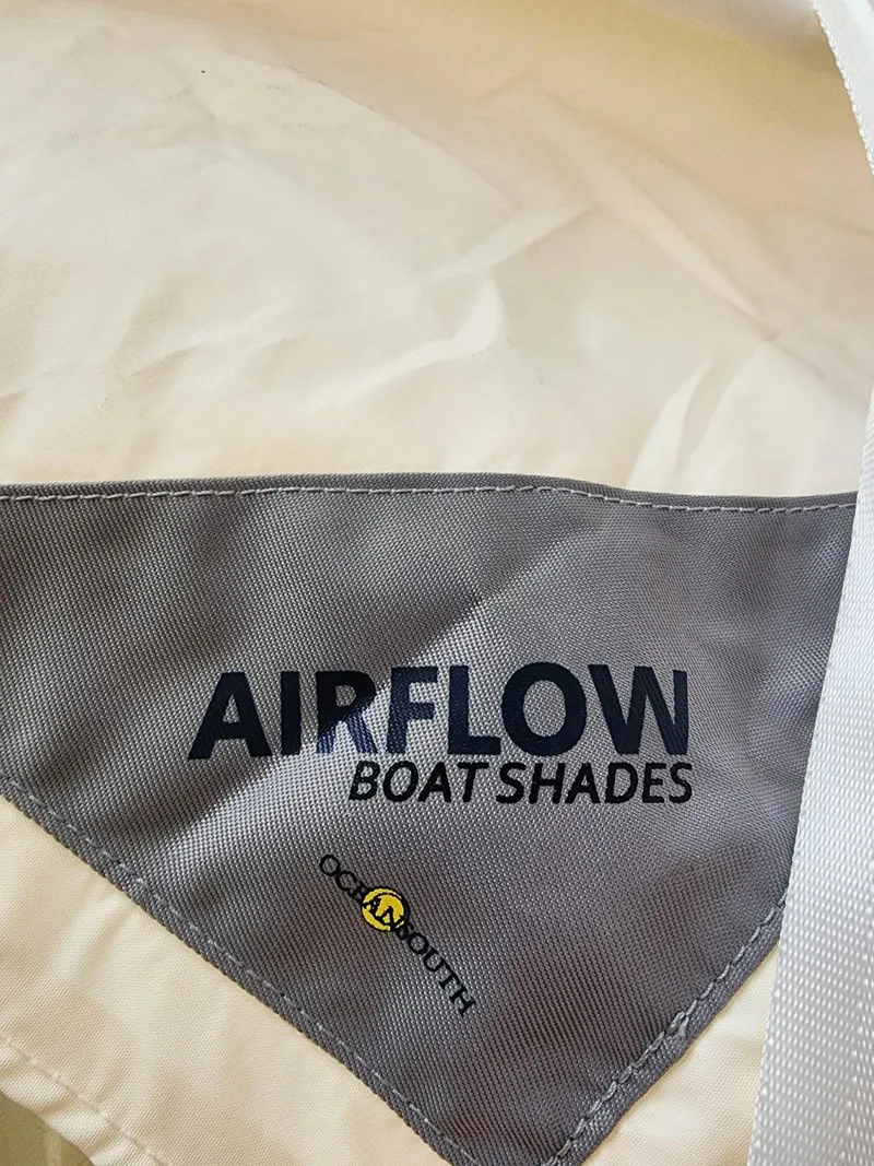 Slide: The Image of Airflow Boat Shades fabric for 2005 Grady-White Bimini 306, featuring Coast South logo. - 46