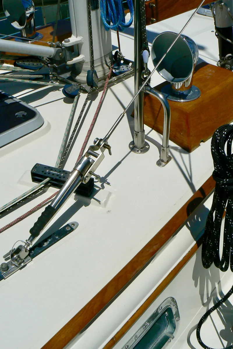 Slide: The Image of Interior of 1999 Pacific Seacraft 40 Voyagemaker yacht with wood finish and teal seating. - 15