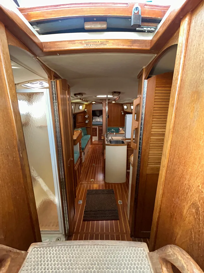 Slide: The Image of Interior view of 1999 Pacific Seacraft 40 Voyagemaker sailboat with wooden finishes. - 25