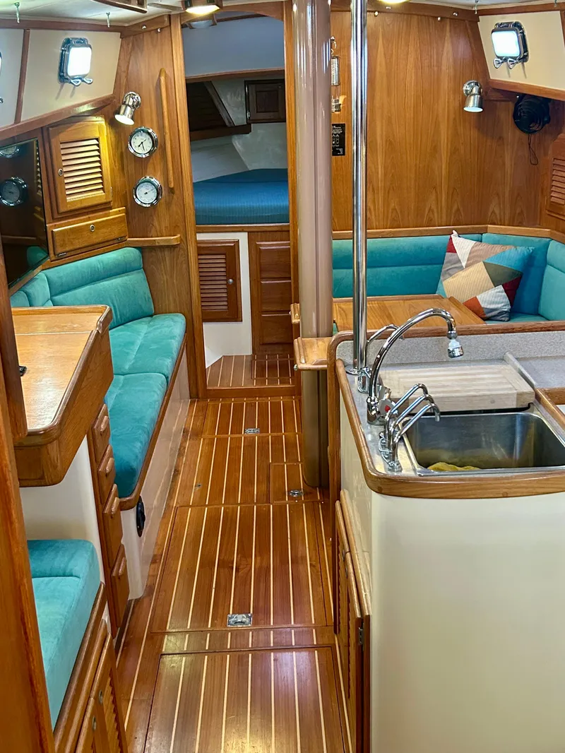 Slide: The Image of Interior of 1999 Pacific Seacraft 40 Voyagemaker yacht bathroom with wooden cabinetry. - 27