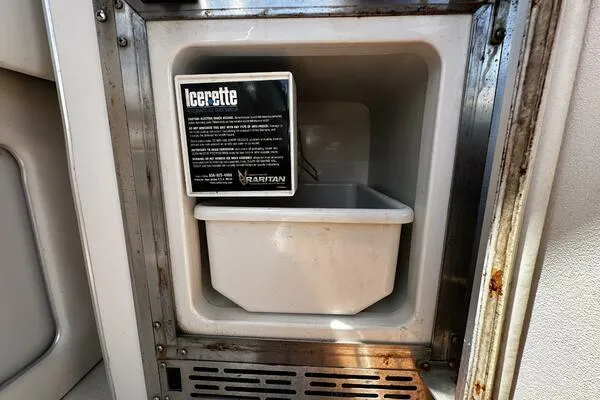 Slide: The Image of Ice maker compartment on 1996 Sea Ray 400 Express Cruiser boat. - 25