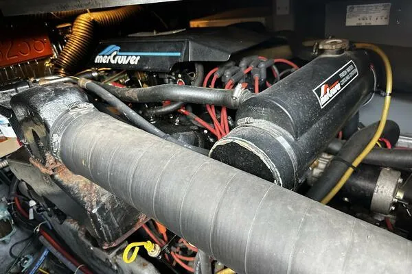 Slide: The Image of Engine compartment of a 1996 Sea Ray 400 Express Cruiser with MerCruiser components. - 32