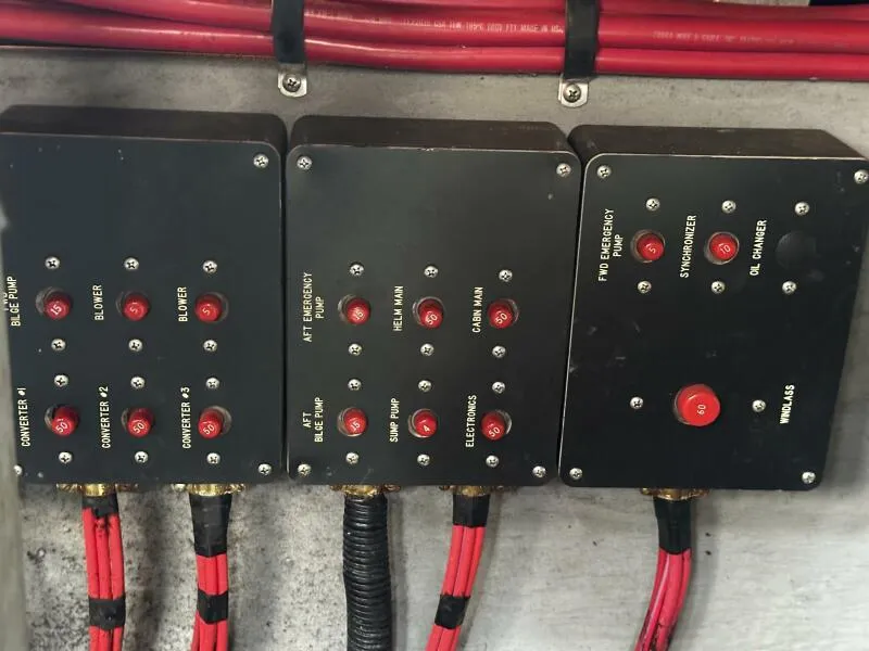 Slide: The Image of Control panels with red buttons and labels on a 1996 Sea Ray 400 Express Cruiser. - 34