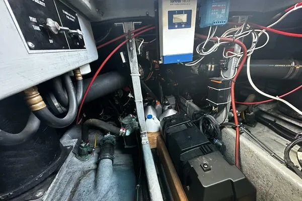 Slide: The Image of Engine room of a 1996 Sea Ray 400 Express Cruiser with wiring and components. - 37