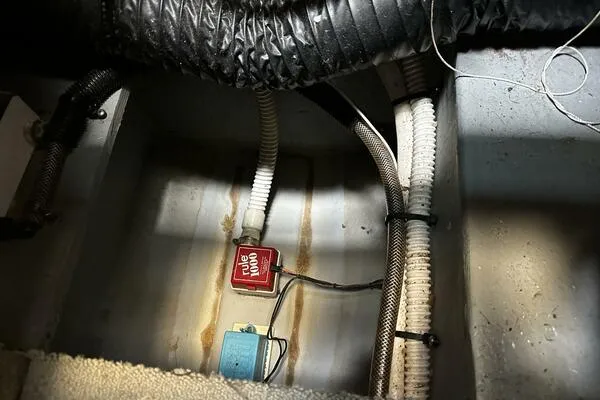 Slide: The Image of Engine compartment of 1996 Sea Ray 400 Express Cruiser with wiring and components. - 38