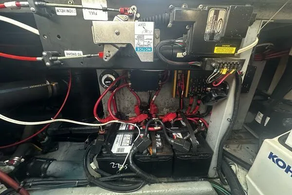 Slide: The Image of Engine compartment of a 1996 Sea Ray 400 Express Cruiser with visible batteries and wiring. - 39
