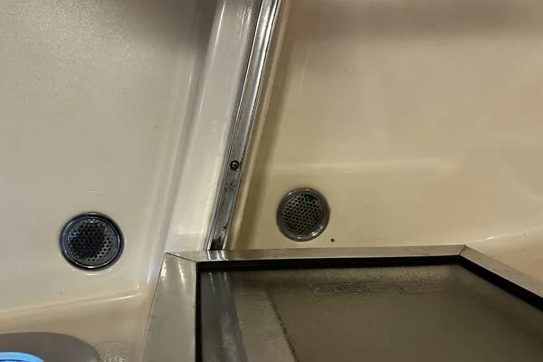 Slide: The Image of Interior detail of a 1996 Sea Ray 400 Express Cruiser, featuring speakers and a sleek design. - 43