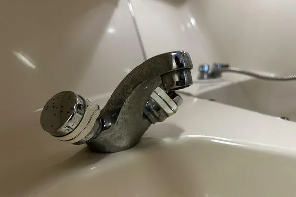 Slide: The Image of Chrome faucet on 1996 Sea Ray 400 Express Cruiser bathroom sink. - 45