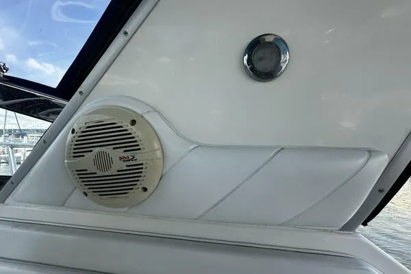 Slide: The Image of 1996 Sea Ray 400 Express Cruiser interior with speaker and porthole detail. - 49