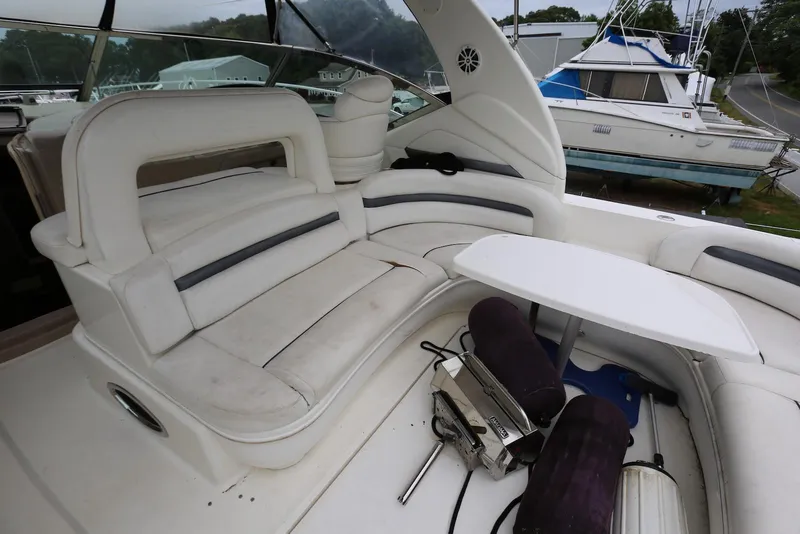Slide: The Image of 2003 Sea Ray 420 Sundancer yacht interior with white seating and table. - 14