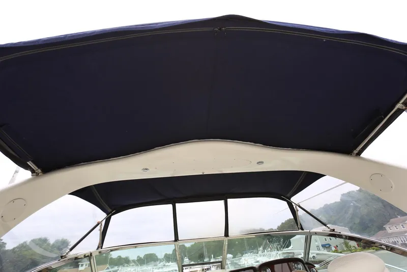 Slide: The Image of 2003 Sea Ray 420 Sundancer boat canopy and windshield view. - 19