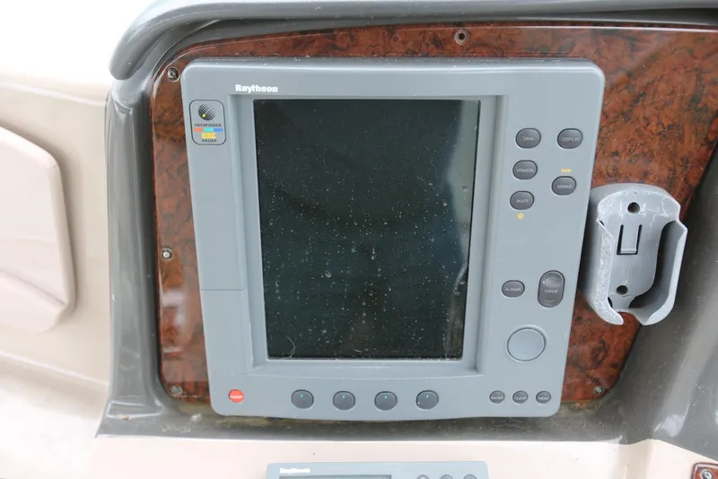 Slide: The Image of Raytheon marine radar display on 2003 Sea Ray 420 Sundancer boat dashboard. - 29