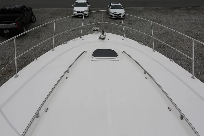 Slide: The Image of 2003 Sea Ray 420 Sundancer yacht deck view with railing and hatch. - 36