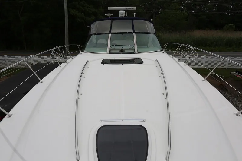 Slide: The Image of 2003 Sea Ray 420 Sundancer yacht deck, featuring sleek design and spacious layout. - 39