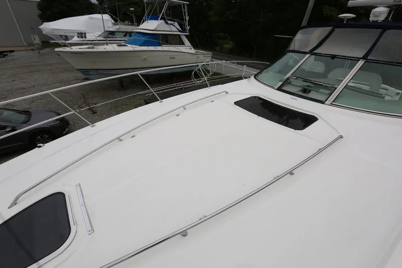 Slide: The Image of 2003 Sea Ray 420 Sundancer yacht on display, showcasing sleek deck design. - 40