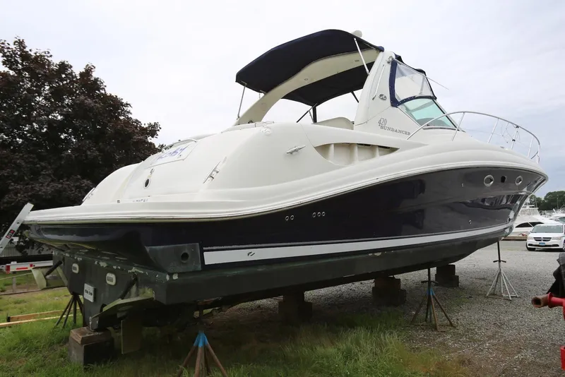Slide: The Image of 2003 Sea Ray 420 Sundancer yacht on dry dock, side view. - 6