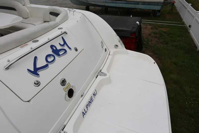 Slide: The Image of 2003 Sea Ray 420 Sundancer boat with "Koby" and "Alpine NJ" text on the stern. - 9
