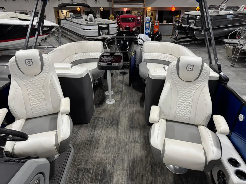 Slide: The Image of 2020 Godfrey 250 Monaco pontoon boat interior with luxurious seating and modern design. - 12