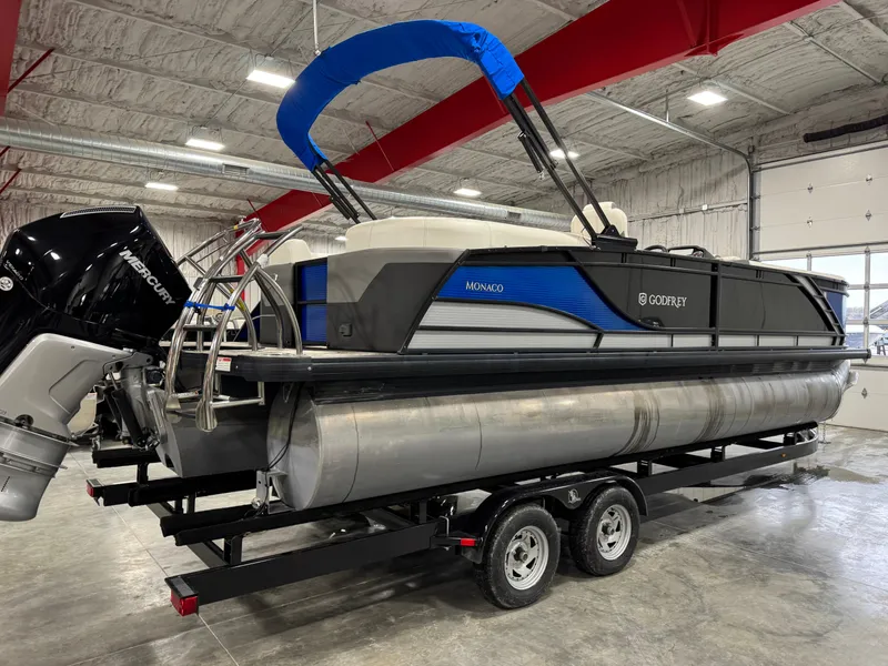 Slide: The Image of 2020 Godfrey 250 Monaco pontoon boat on trailer in indoor storage facility. - 4