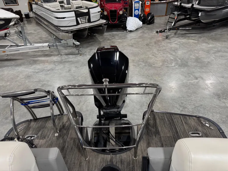 Slide: The Image of 2020 Godfrey 250 Monaco pontoon boat with outboard motor in showroom. - 9