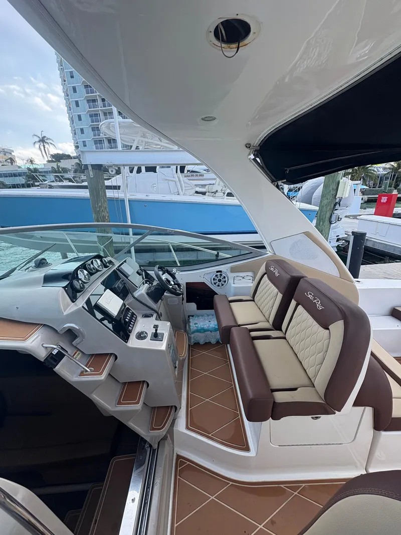 Slide: The Image of 2008 Sea Ray 330 Sundancer cockpit with luxurious seating and modern dashboard. - 11