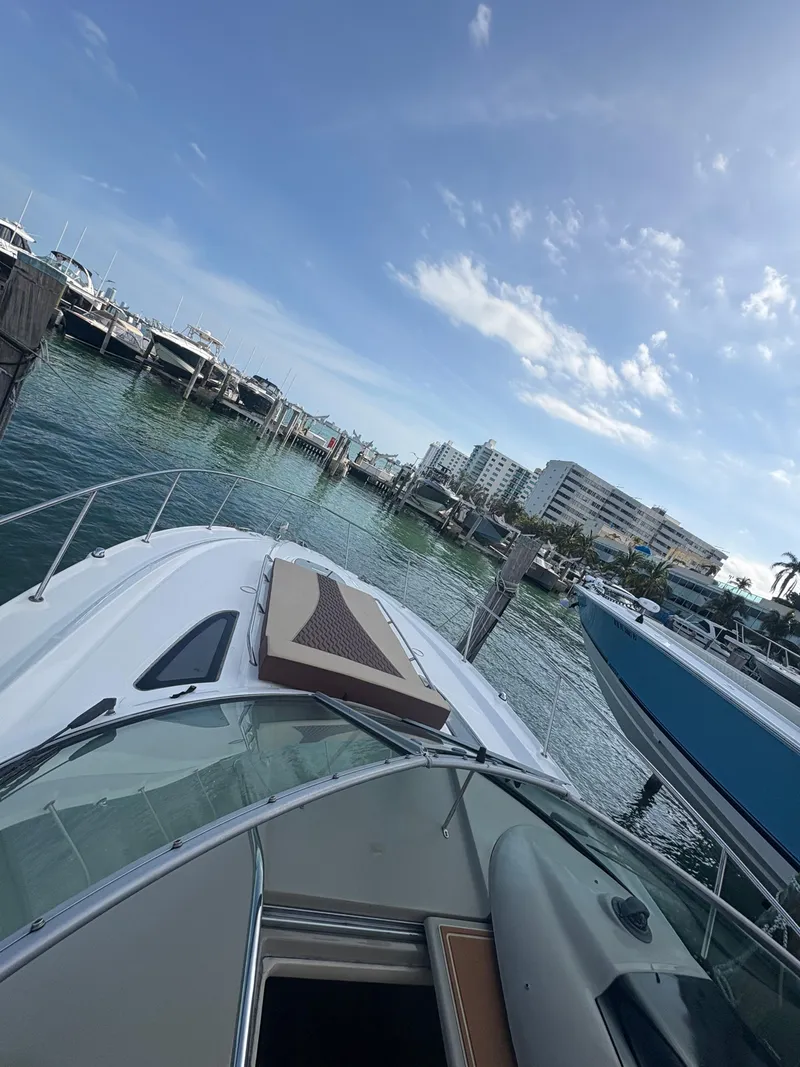 Slide: The Image of 2008 Sea Ray 330 Sundancer docked at marina under clear blue sky. - 13