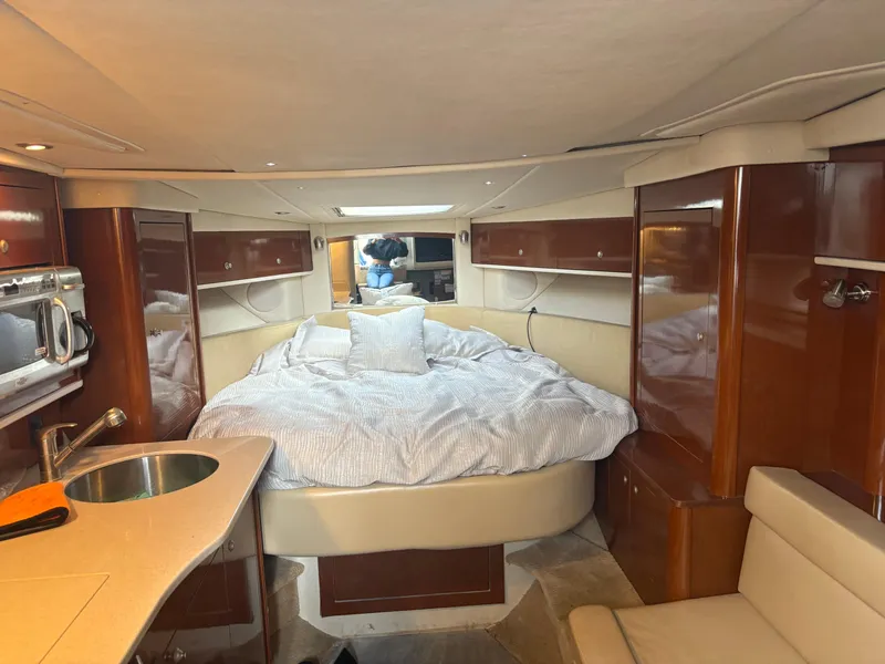 Slide: The Image of Interior of 2008 Sea Ray 330 Sundancer with cozy bed and modern amenities. - 14