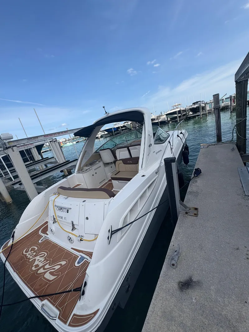 Slide: The Image of 2008 Sea Ray 330 Sundancer docked at marina under clear blue sky. - 4