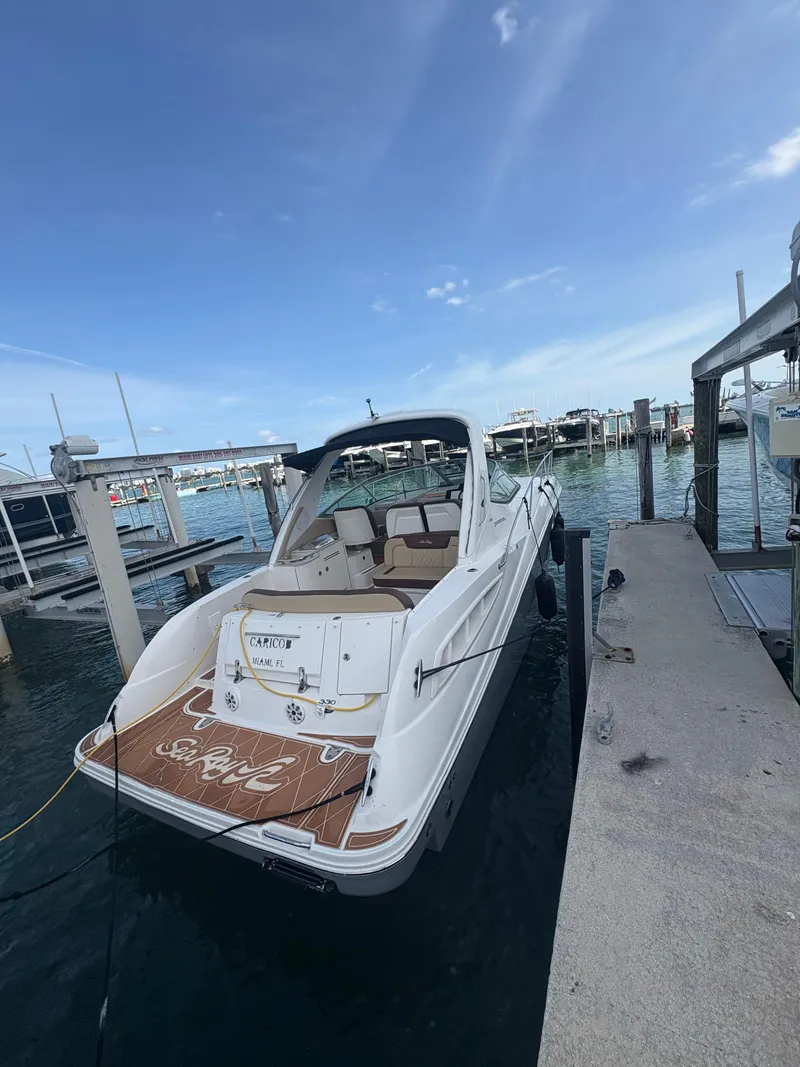 Slide: The Image of 2008 Sea Ray 330 Sundancer docked at marina under clear blue sky. - 6