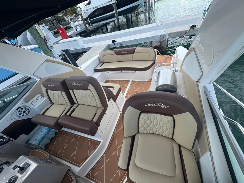 Slide: The Image of 2008 Sea Ray 330 Sundancer interior with luxurious seating and elegant design. - 9
