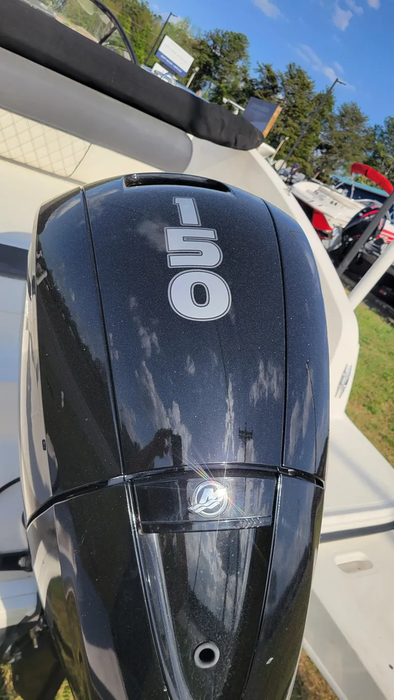 Slide: The Image of Outboard motor on 2021 Bayliner DX 2200 boat, displaying "150" horsepower. - 6